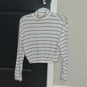 White top with brown stripes and slight turtle neck